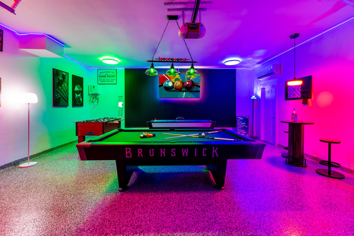 Private Game Room with neon lighting, pool table and air hockey
