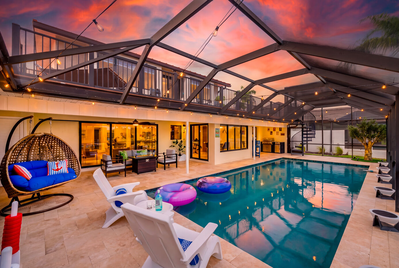 Heated pool at sunset with string lights
