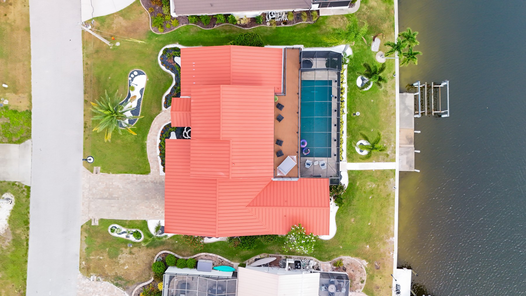 Aerial view of 127 Hibiscus with pool, lanai and canal