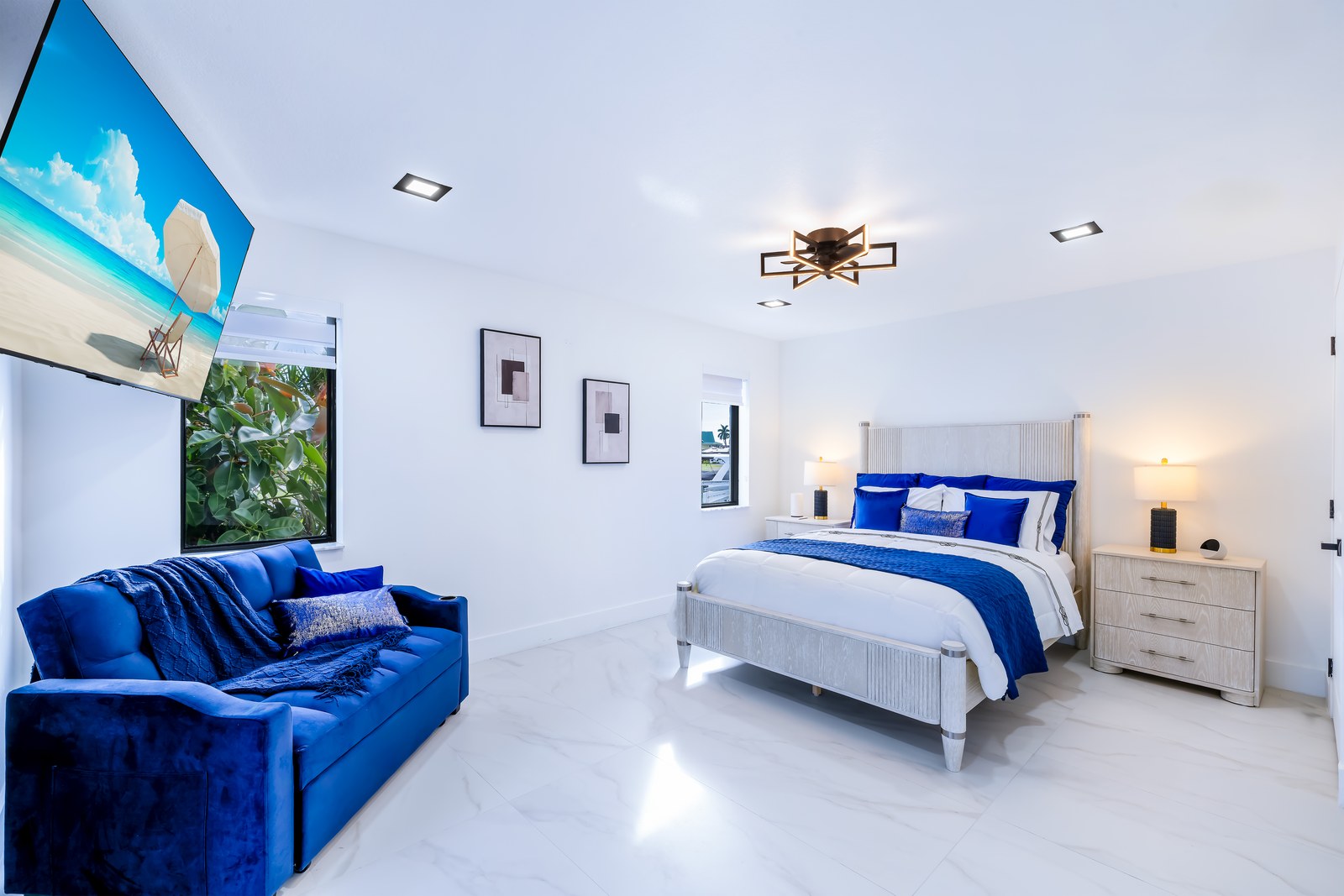 Soft Suite with blue accents and light wood bed